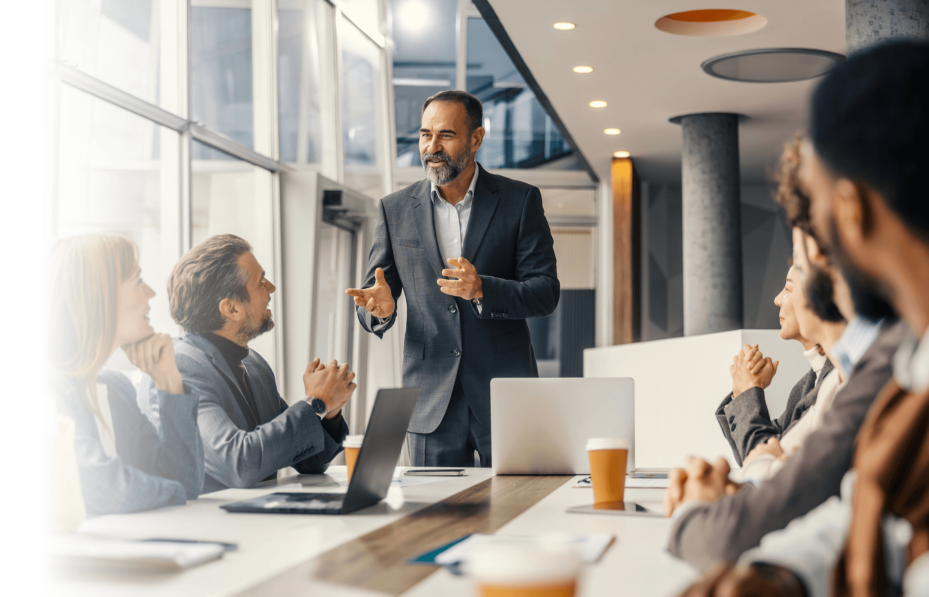 Senior engineering leaders in conversation around a conference table