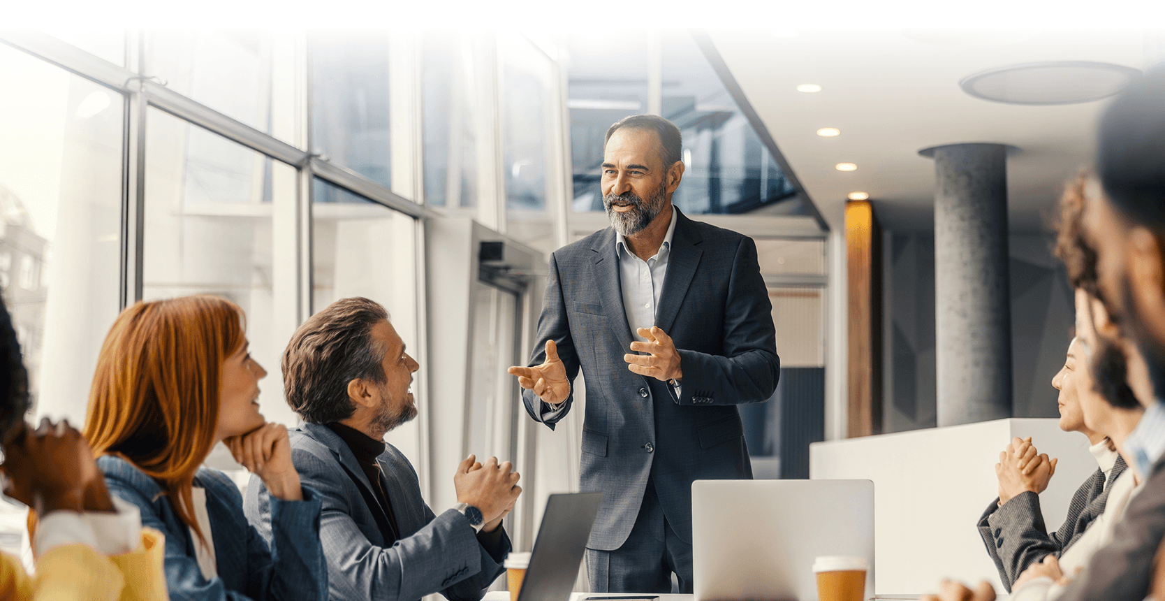 Senior engineering leaders in conversation around a conference table